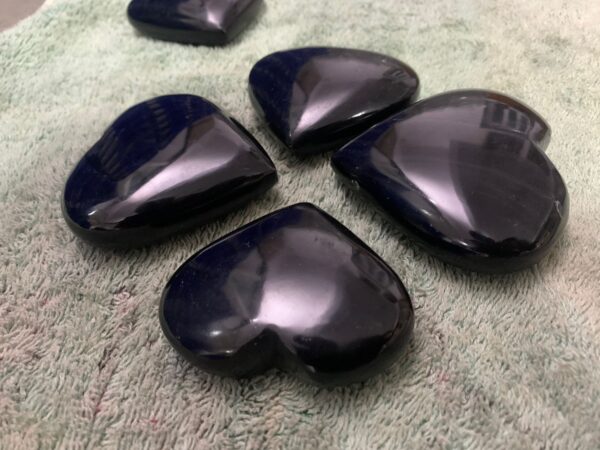 Obsidian Elegance: Gilded Heart-Shaped Coaster Set